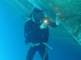THE UNDERWATER ACTIVITY TO PLUG THE SEA CHEST FOR THE VESSEL AT DUNG QUAT PORT